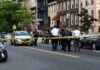 12 DEAD – Coordinated Ambush Shocks City! Police gathered at an urban crime scene.
