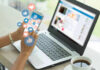 Britain’s Teen Social Media Ban Backfires! Person using smartphone and laptop with social media icons.