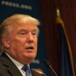 Pastor For Trump Scandal Implodes Overnight! A public figure speaking at a podium during a press conference