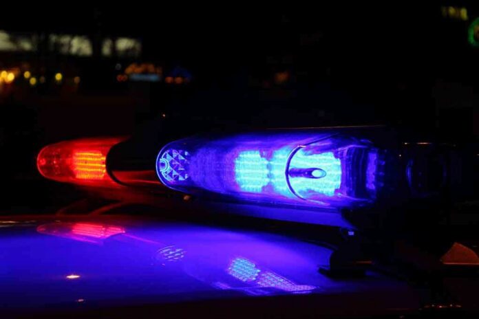 shutterstock_206223412-1 Close-up of police lights flashing in blue and red at night