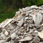 A large pile of construction debris consisting of broken concrete and other materials