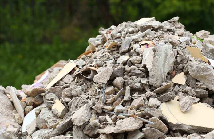 shutterstock_223337167 A large pile of construction debris consisting of broken concrete and other materials