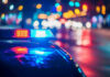 Illegal Alien FIREBOMBS Two Churches! Police car with flashing lights at night.