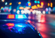 Illegal Alien FIREBOMBS Two Churches! Police car with flashing lights at night.