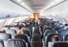 Passenger Invokes Sharia Law – Refuses Sitting Next to Woman Airplane cabin with passengers seated in rows