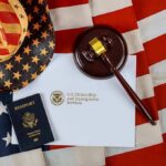 Trump Activates Secret Terror Court U.S. passport, gavel, and USCIS document on American flag