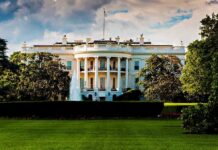 Officials Demanded To Hand Over Phones in White House The White House surrounded by greenery and a fountain in the foreground