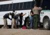 ICE Raid Nabs Illegal During MAGA Voter’s Wedding Border patrol officers investigating people near a bus.