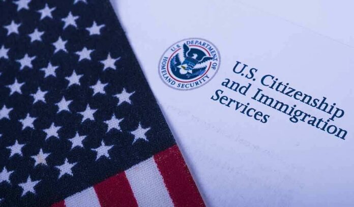 shutterstock_1096509923 American flag beside U.S. immigration document
