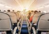 Preacher KICKED OFF Flight For Doing This! airplane cabin with passengers seated in economy class