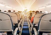 Preacher KICKED OFF Flight For Doing This! airplane cabin with passengers seated in economy class