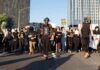 BLM Protests Erupt Right in Time For The Midterms Protesters march down a city street holding signs