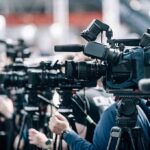 Hero Marine’s SHOCKING Reenlistment Stuns Pentagon Broadcast cameras on tripods at a press event