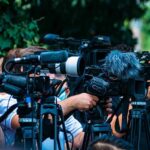 OUSTED RINO Senator Just Defected Again! TV news cameras crowding together at an outdoor event
