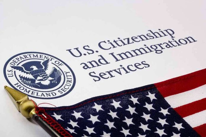 shutterstock_101132716 U.S. Citizenship and Immigration Services document with American flag