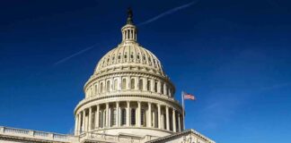 United States Capitol dome against clear blue sky