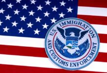 ICE Gunfire Ignites Austin Uproar U.S. immigration and customs enforcement seal on American flag