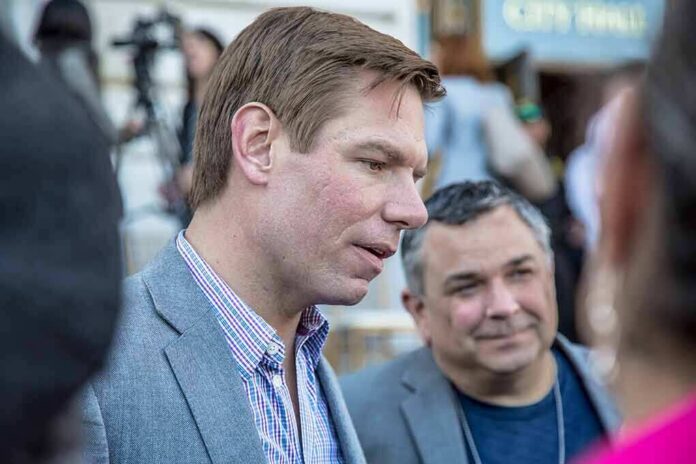 Eric Swalwell speaking with people at an outdoor event