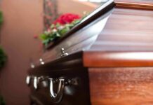 Wooden casket with floral arrangement