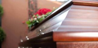 Wooden casket with floral arrangement