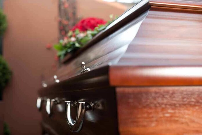 Wooden casket with floral arrangement