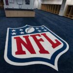 NFL logo on the floor of an empty locker room