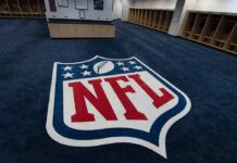 NFL Fans Outrages After Leagues Latest Change NFL logo on the floor of an empty locker room