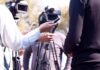press interview with microphones and cameras outdoors