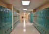 School hallway with rows of teal lockers