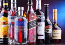 Assorted liquor bottles arranged in a row