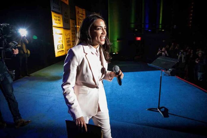 Woman in a light suit holding a microphone on a stage