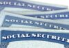 Social Security cards stacked in a close-up view