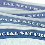 ICE Nabs Illegals in Social Security Theft Sting Social Security cards stacked in a close-up view
