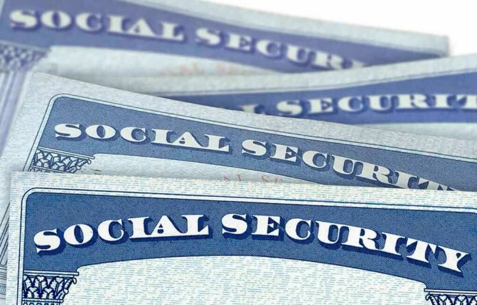 shutterstock_1429081610 Social Security cards stacked in a close-up view