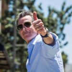 Illegal Alien Accused of Impregnating 14-Year-Old Daughter Walks Free man in sunglasses giving a thumbs-up outdoors