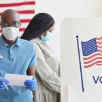 Illegals Offered Taxpayer-Funded Legal Services Voters wearing masks at a polling station