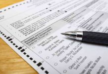 DHS Witch Hunt Falls Apart as It Can’t Name a Single Noncitizen Voter Ballot paper with pen on wooden surface