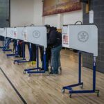 Radical Far-Left Afghani Wins US House Special Election Voters at polling booths in a gymnasium