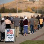 Socialist Upset Jolts Congressional Primary voters standing in a long line outside a polling place