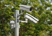 surveillance cameras mounted on a metal pole