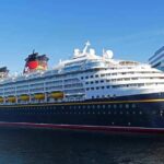 Cruise ship docked at a modern harbor terminal