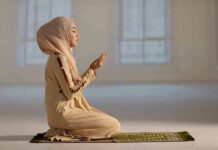 Tax-Funded Ramadan Sparks Lawsuit Woman in hijab praying on a mat indoors