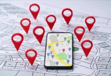 Travel App Outs U.S Troops Homes Smartphone with map app surrounded by red location pins
