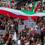 Iran Protestors ERUPT In NYC Amid UN Meeting Protest crowd with flags and signs; Seyed Ebrahim Raisi, La Parka, Brian Robiskie, Philly Brown, Miguel Francisco Barragán Andrade present