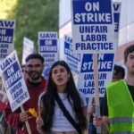 Nurses ABANDON Hospital Posts in Anti-ICE Protests Group of protesters holding blue strike signs while marching