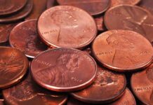 Congress Demolishes 242-Year American Staple pile of copper pennies with heads side up