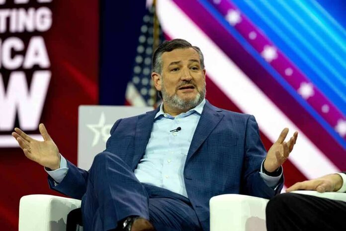 man in blue suit speaking on stage