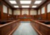 Empty courtroom with wooden benches and judge's bench