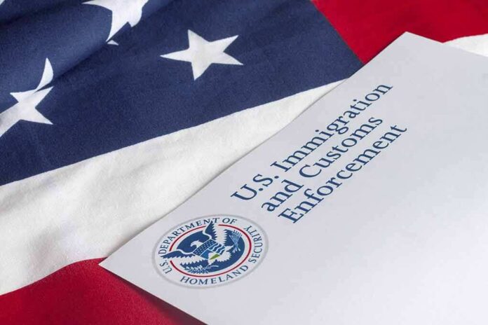 shutterstock_300476858 U.S. ICE document on American flag