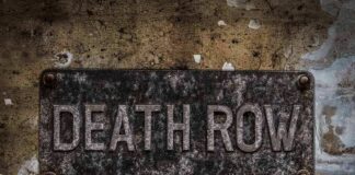 Rusty metal sign on worn concrete wall